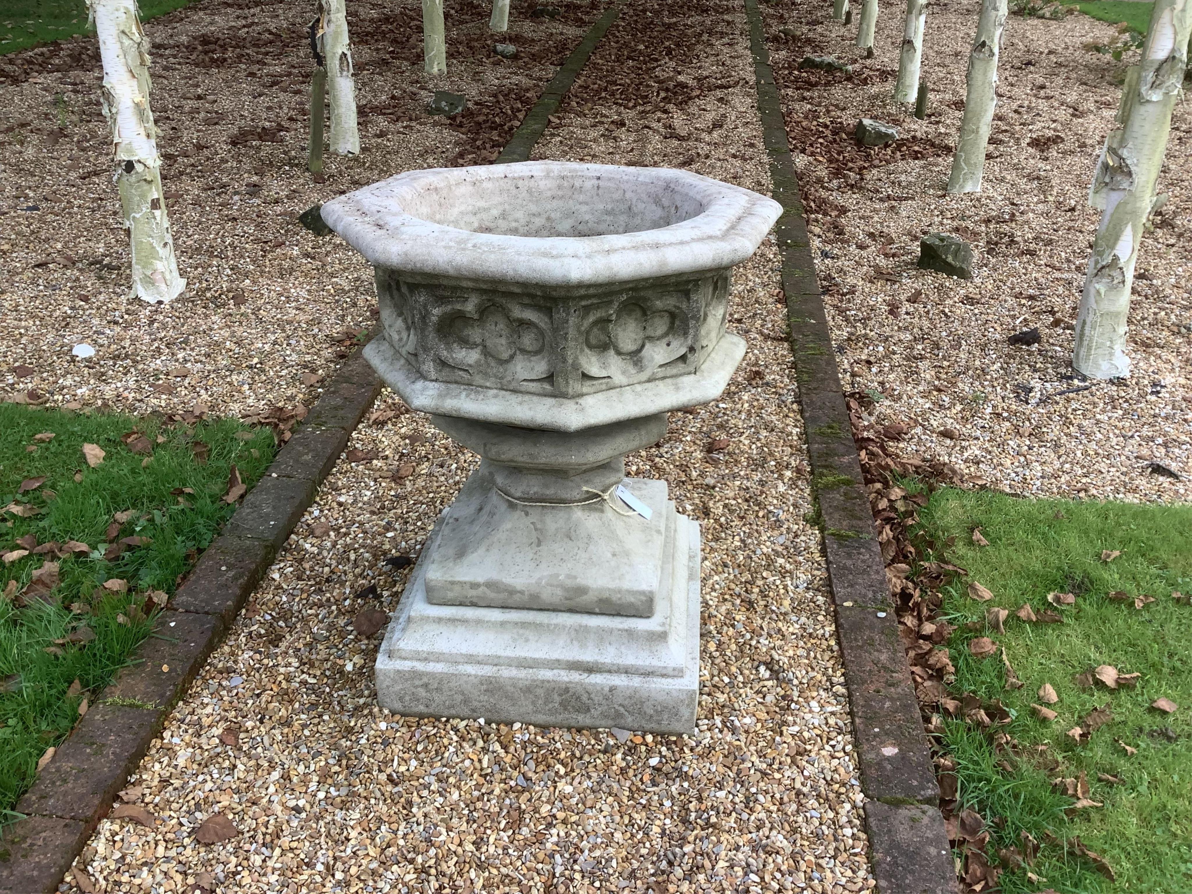 A reconstituted stone font planter, width 62cm, height 72cm, planting removed. Condition - weathered, otherwise good